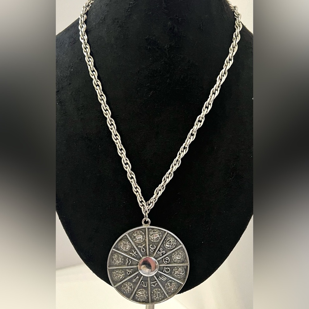 Zodiac Wheel Astrology Pendant Circa 1972
Marked NAPIER Silver Tone Neck…